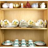 Three shelves of porcelain china