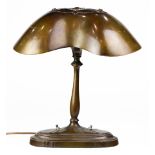 An Art Nouveau patinated bronze table lamp