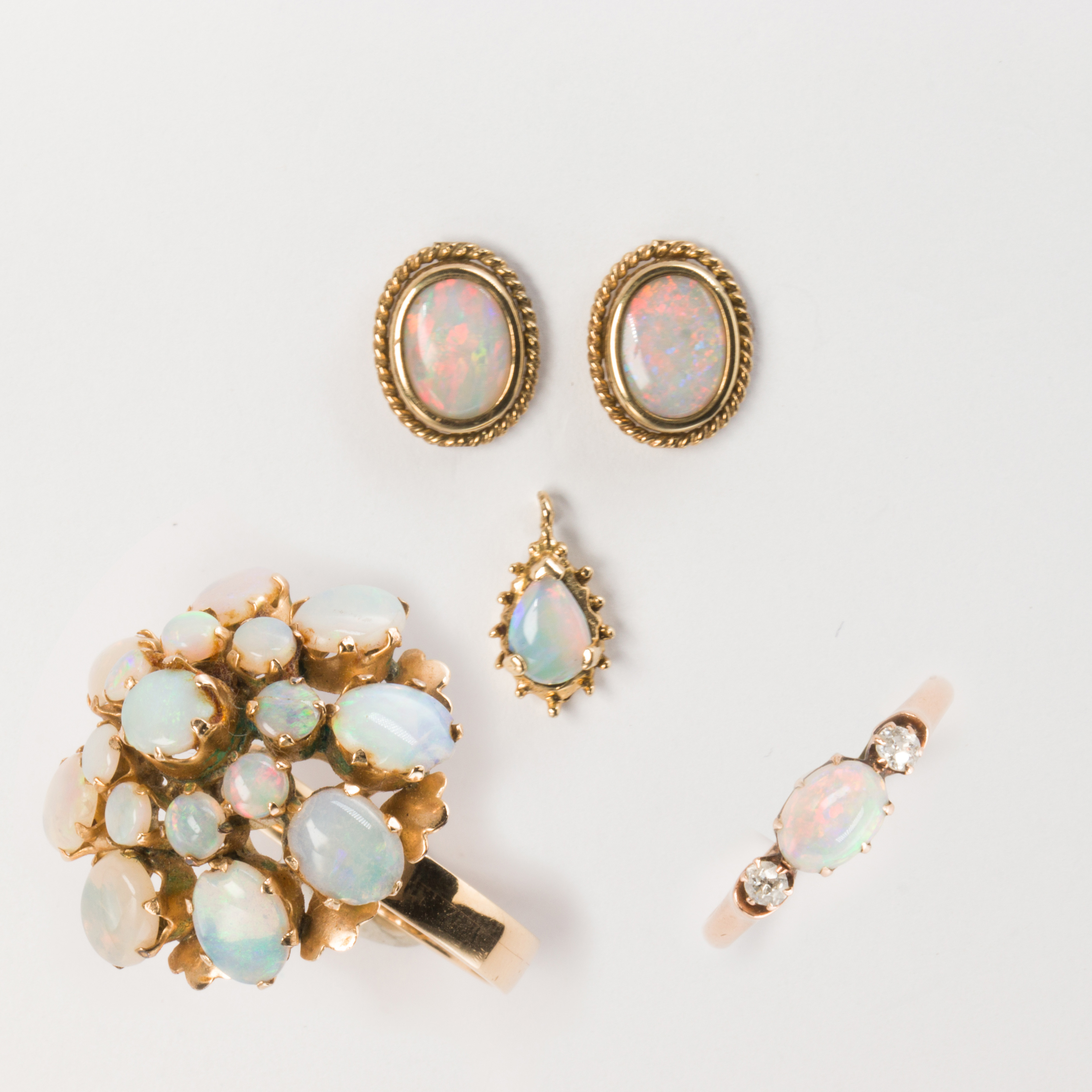 A group of opal and gold jewelry