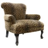 A Moderne leopard print lounge chair and ottoman