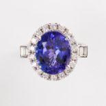 A tanzanite, diamond and fourteen karat white gold ring