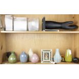 Two shelves of ceramic and glass vases