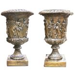 A pair of large Renaissance style floor standing urns