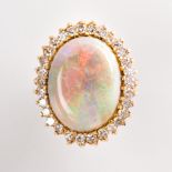 An opal, diamond and fourteen karat gold ring