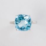 A blue topaz and fourteen karat white gold ring