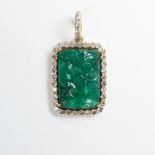 An emerald, diamond and eighteen karat gold pendant