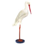A crane or stork baby department advertising figure