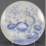 Japanese Arita blue and white charger with garden landscape with peony and prunus branches