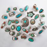 A group of turquoise or coral and silver jewelry