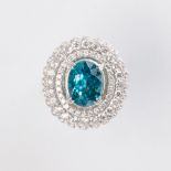 A blue zircon, diamond and fourteen karat gold ring