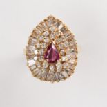 A ruby, diamond and fourteen karat gold ring