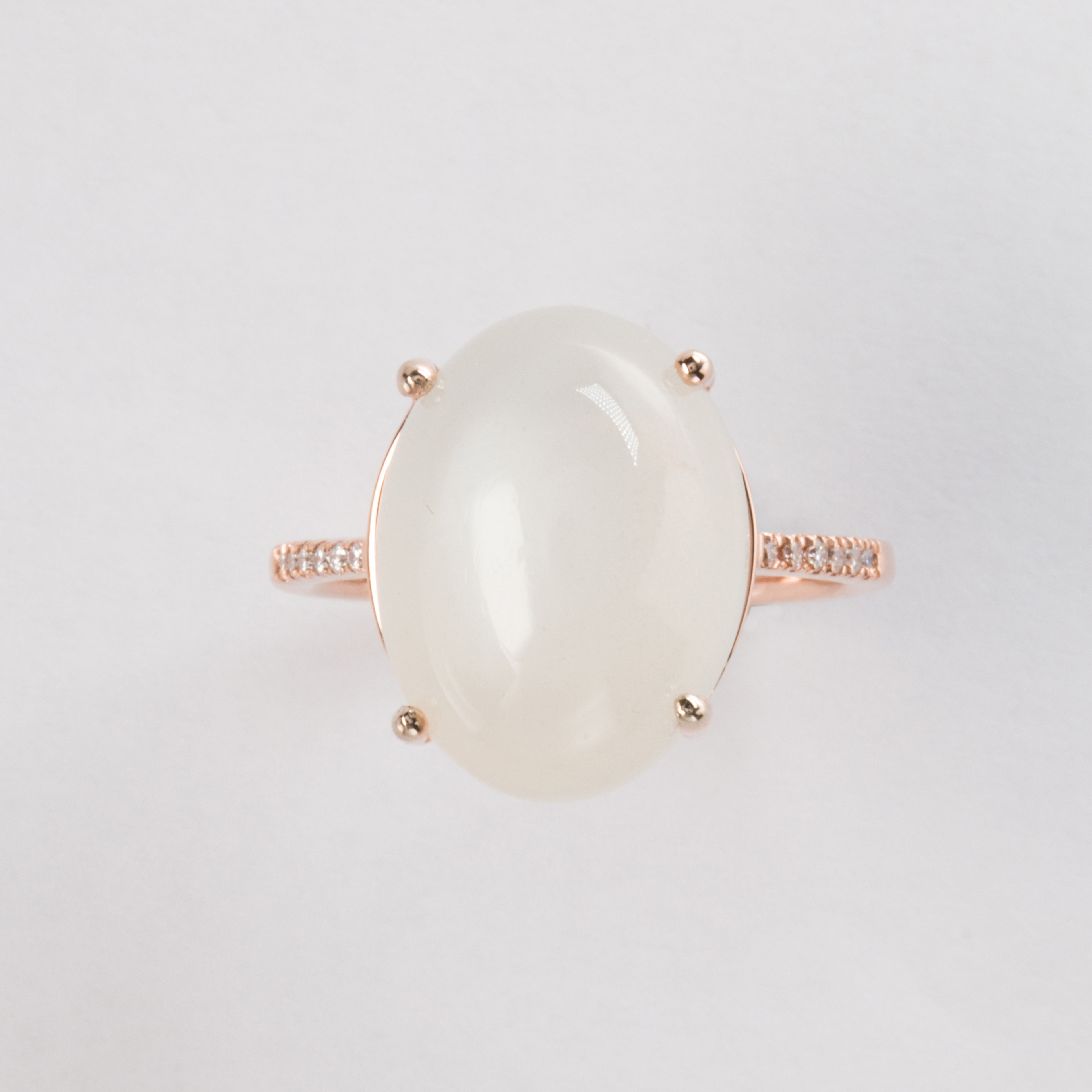 A moonstone and fourteen karat rose gold ring