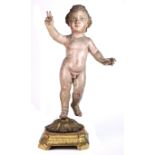 Continental polychrome decorated carved wood figural sculpture of a cherub