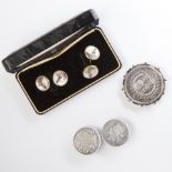 A group of cufflinks and brooch