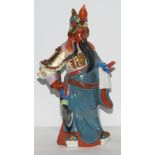 A Japanese style polychrome porcelain figural sculpture