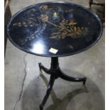 A chinoserie style black lacquered tea table