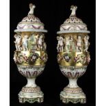 A pair of monumental Capodimonte decorated urns