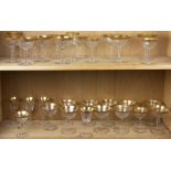 Two shelves of gilt banded stemware