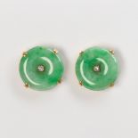 A pair of jade and fourteen karat gold earrings