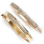 A group of diamond and fourteen karat gold bangles