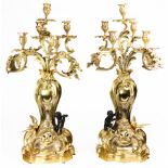A pair of Empire style gilt mounted five light candelabra
