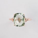 A greenish blue quartz and fourteen karat rose gold ring