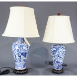 Associated pair of Chinese blue and white oviform vases mounted as lamps