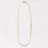 A diamond and fourteen karat gold necklace