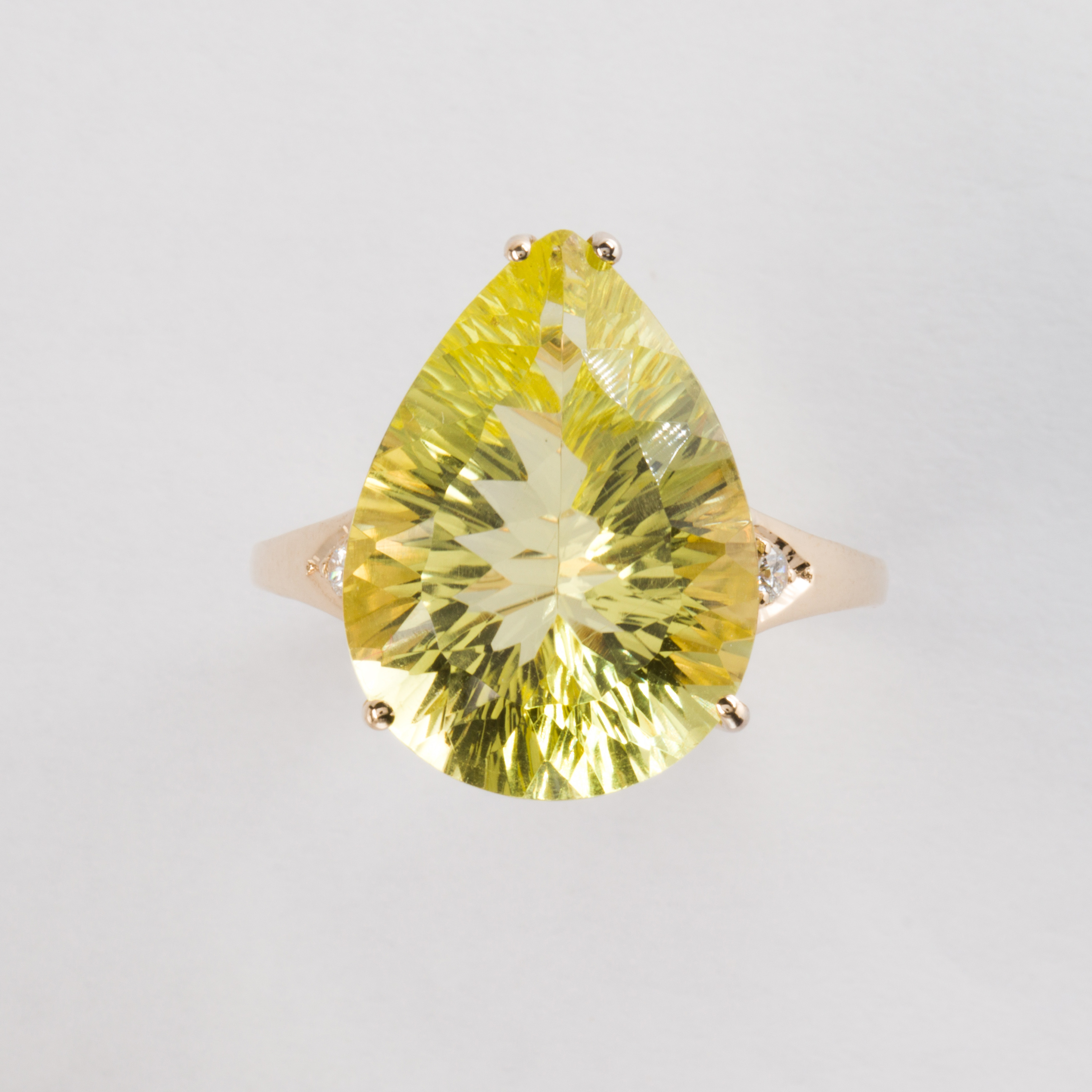 A yellow quartz and fourteen karat gold ring