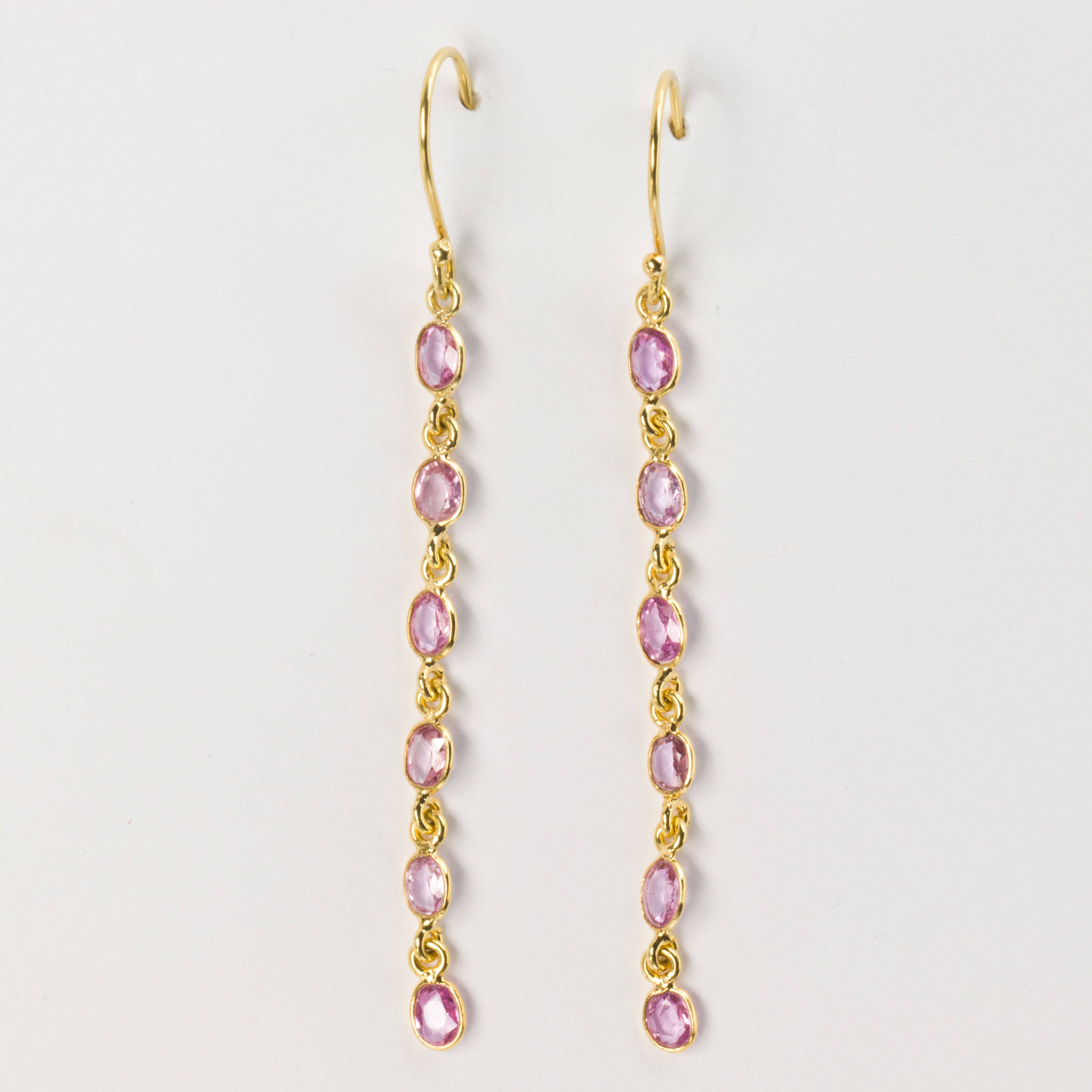 A pair of pink tourmaline and eighteen karat gold earrings