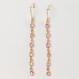 A pair of pink tourmaline and eighteen karat gold earrings