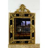 A continental giltwood carved looking glass