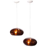 A pair of Mid Century Modern pendant lamps