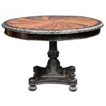 A continental partial ebonized and marquetry decorated tilt top table