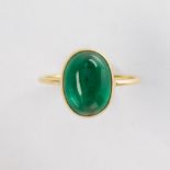 An emerald and eighteen karat gold ring