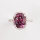A pink spinel diamond and eighteen karat white gold ring