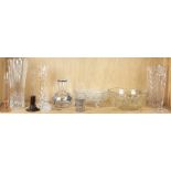 One shelf of cut glass bowls and decorative items
