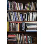 Four shelves of art books: topics include Picasso