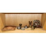 A shelf of Tibetan and Indian decorative items