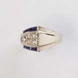 A Retro diamond, sapphire and fourteen karat white gold ring