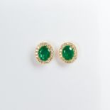 A pair of emerald, diamond and eighteen karat gold earrings