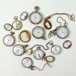 A collection of pocket watches and cameos