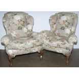 A pair of Queen Anne wing back armchairs