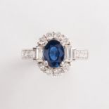 A sapphire, diamond and fourteen karat gold ring