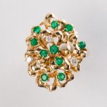 An emerald and diamond fourteen karat gold ring