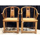 A Chinese pair elmwood horseshoe chairs