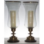 Pair of Neoclassical style gilt bronze hurricane lamps with glass shades