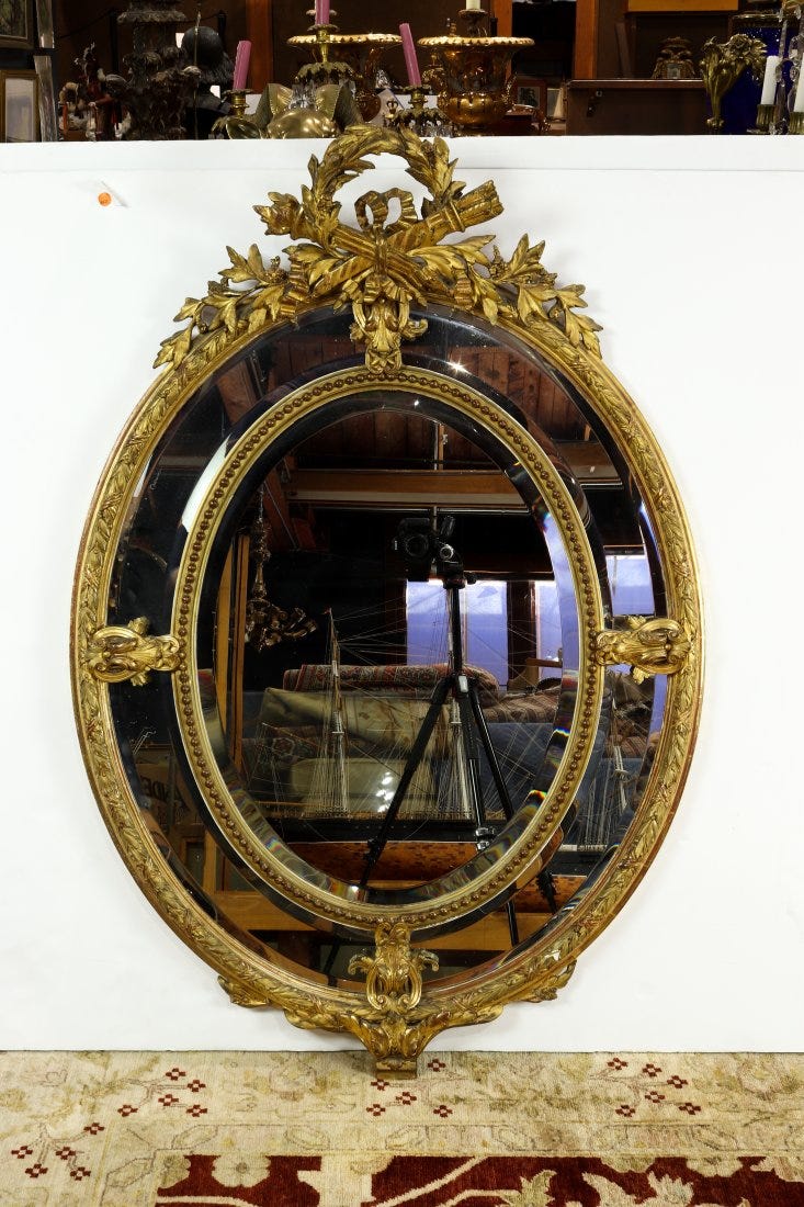 A Rococo style giltwood mirror, 19th century