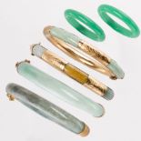 A group of jade or glass bangle bracelets