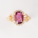 A ruby, diamond and fourteen karat gold ring